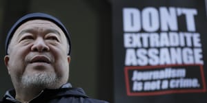 Ai Weiwei holds silent protest outside Julian Assange's extradition hearing