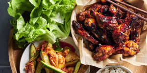 Sticky Korean chicken wings with kimchi-pickled cucumbers. 