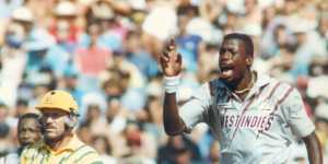 Curtly Ambrose and the famous sweatbands,with Allan Border watching on.
