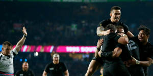Celebration:Sonny Bill Williams jumps on the huddle after Ma'a Nonu scores New Zealand's second try.