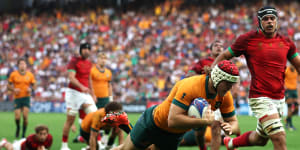 The Wallabies kept their slim World Cup hopes alive with a bonus-point win over Portugal.