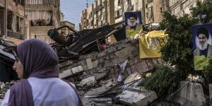 Portraits of slain Hezbollah leader Hassan Nasrallah on a destroyed street in Dahiya.