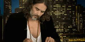Accused rapist Russell Brand has found God. If only he knew how to find Bible verses on live TV