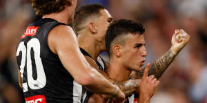 Nick Daicos celebrates. 