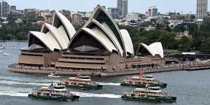 Ferries race past the Opera House in the annual Ferrython. 