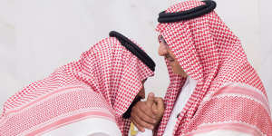 A newly appointed Mohammed bin Salman,left,kisses the hand of Prince Mohammed bin Nayef at the royal palace in Mecca,Saudi Arabi in 2017.