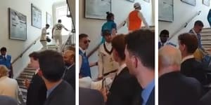 Usman Khawaja spoke with security as he climbed the stairs.