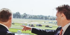Premier Chris Minns,with Australian Turf Club chair Peter McGauran,at Rosehill Racecourse in December.