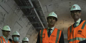 Infrastructure Minister Rob Stokes,left,and Premier Dominic Perrottet inspect a new rail tunnel late last year.