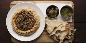 Hummus with lamb and flatbread.