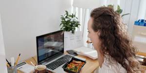 If your co-worker talks with their mouth full,you should definitely bring this up with them.