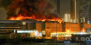 A massive blaze is seen over the Crocus City Hall on the western edge of Moscow after gunmen opened fire on a concert hall.