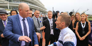 Danny O'Brien,left,talks to jockey Damien Oliver after winning race two with Miami Bound during Derby day. 