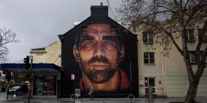 A nearby mural of former Sydney Swans player Adam Goodes,also faciliated by Apparition Media.