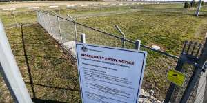 The site sits behind barbed wire on the fringe of Melbourne. 