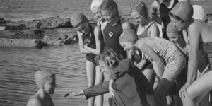 Former Empire Games champion and 1936 Olympic representative Pat Norton gives tuition to 12-year-old Jill Gardner at Dee Why rock pool.