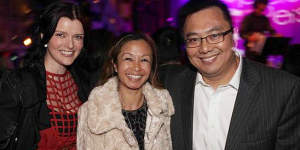 Amber Harrison (left),with her boss Nick Chan and his wife Peggy. Chan was responsible for approving Harrison's $500,000 in expenses over five years.