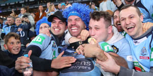 James Tedesco celebrates with fans after NSW's series victory last year.