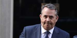 Britain's Secretary of State for International Trade Liam Fox leaves 10 Downing Street in London after a cabinet meeting,Tuesday.
