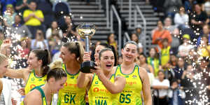 Victors on the court:Diamonds captain Liz Watson holds the Constellation Cup after beating New Zealand on Sunday night.