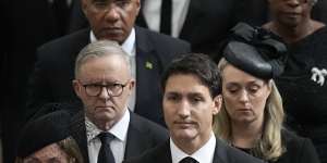 Prime Minister Anthony Albanese with his partner Jodie Haydon are pictured behind Canadian Prime Minister Justin Trudeau at the state funeral for Queen Elizabeth.