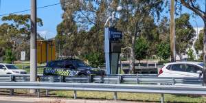 A police car remains at the site of the crash on Stud Road,Dandenong North,on Sunday afternoon.