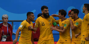 Mile Jedinak celebrates his equalising penalty.