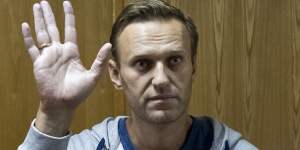 Russian opposition leader Alexei Navalny gestures in a court room in Moscow.