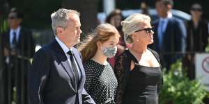 Former leader of the Opposition Bill Shorten,wife Chloe Shorten and daughter Clementine arrive ahead of the funeral service.