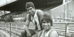 Jim (left) and Phil Krakouer while playing for North Melbourne in the 1980s.
