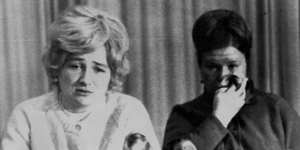 Lyudmila Petrovna Belenko (left) reads a statement at a Moscow news conference,asserting that her husband,Viktor,did not want to defect,1976. Belenko rejected claims he left a wife and child behind.