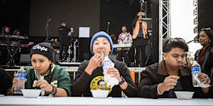 Taste test:Adhish Rai,centre,in blue beanie,competes in the momo speed eating competition at Momo Fest.