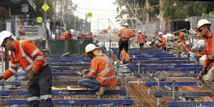 Construction workers and engineers hard at work on a major infrastructure project. 