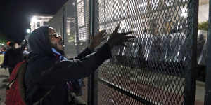 A protester shouts at police during clashes outside the Kenosha County Courthouse.