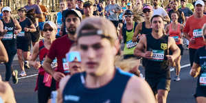 Sydney Marathon entrants run across the Harbour Bridge.