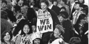 Joanne Hales with an early poster depicting Sydney's win,September 24,1993.