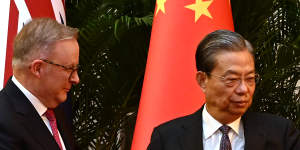 Chairman of the National People’s Congress Zhao Leji greets Prime Minister Anthony Albanese in the Great Hall of the People in Beijing on Monday.