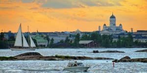 Sunset over Helsinki cathedral and the harbour.