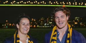 Wallabies captain Michael Hooper stands with Wallaroos captain Shannon Parry ahead of the final vote for the hosting of the Rugby World Cups in Sydney,Australia.