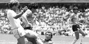 Diego Maradona (second left) is about to score his second goal against England. England's Terry Butcher (left) tries to tackle Maradona,while England's goalkeeper Peter Shilton is on the ground.