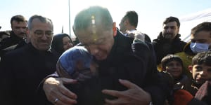 Turkish President Recep Tayyip Erdogan hugs a survivor in Kahramanmaras,a city devastated by last month’s earthquakes.
