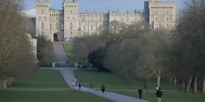 Pedestrians walk the Long Walk in front of Windsor Castle.