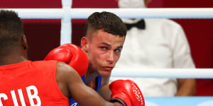 Harry Garside takes on Cuban Andy Cruz during the Tokyo Olympics.