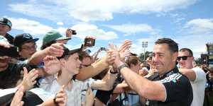 Shane Gallen and Paul Gallen celebrate Cronulla’s 2016 premiership with fans.