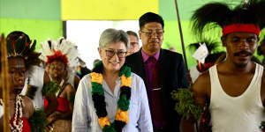 Penny Wong,pictured in Papua New Guinea,has visited 12 Pacific nations since the election.