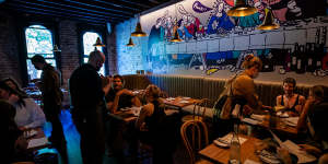 A Last Supper-style mural dominates the upstairs dining room at Paski Sopra.