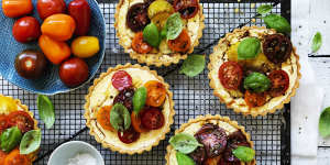 Tartlets topped with seasonal tomatoes.
