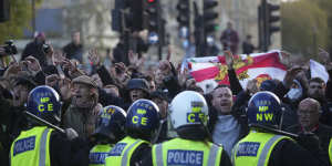 Counter-protesters confront police in Parliament Square.