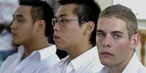 Australian drug suspects Matthew Norman,right,Si Yi Chen,center and Tach Duc Thanh Nguyen sit in a court room during they trial in Denpasar Bali,Indonesia,Wednesday,Oct. 26,2005. All three were arrested in Bali by police in April and are facing court on heroin smuggling charges.