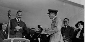 The Duke of Gloucester handing over the Royal Mail Bag at the opening of the air mail service to England.
